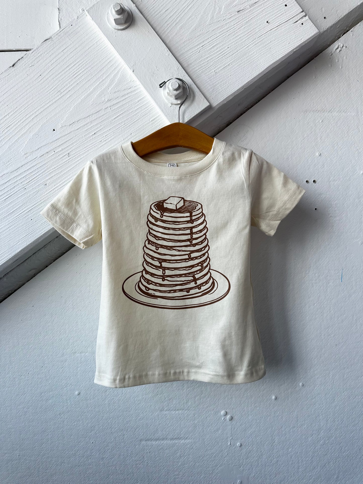 Kids graphic T-shirt featuring a playful pancake design from The Wishing Elephant, perfect for kids' casual wear.