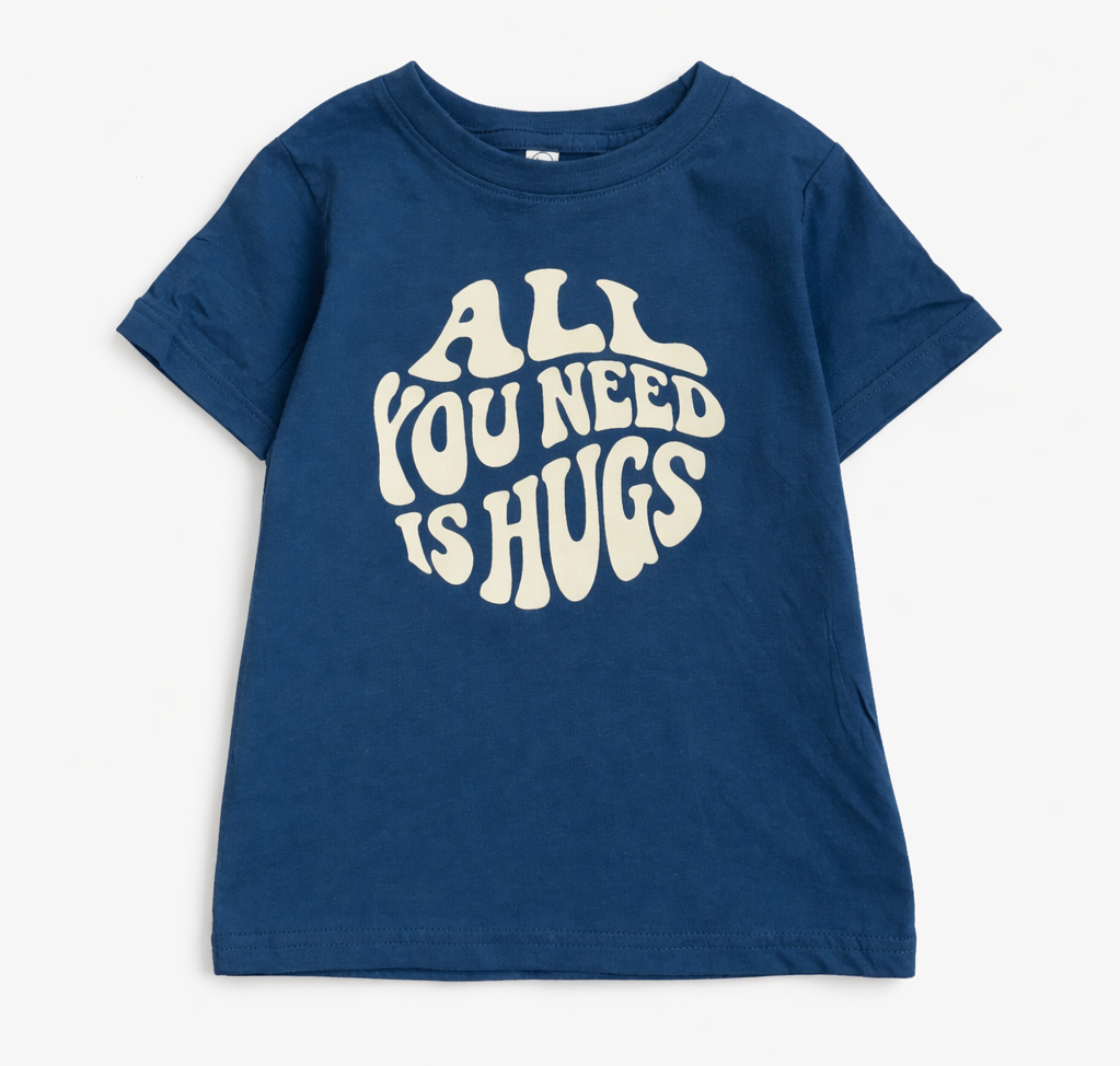 Kids graphic T-shirt by The Wishing Elephant with "All You Need Is Hugs" print, featuring a colorful, playful design for children.
