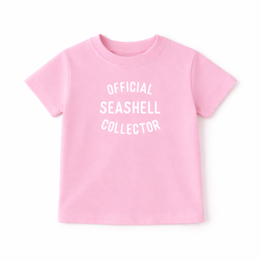 Kids graphic T-shirt by The Wishing Elephant featuring playful seashell and beach designs for a fun summer look.