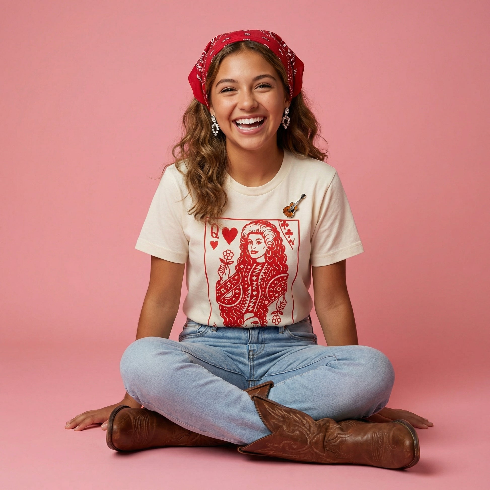 Adult Queen of Hearts T-shirt featuring Dolly Parton design by The Wishing Elephant, with vibrant heart-themed artwork.