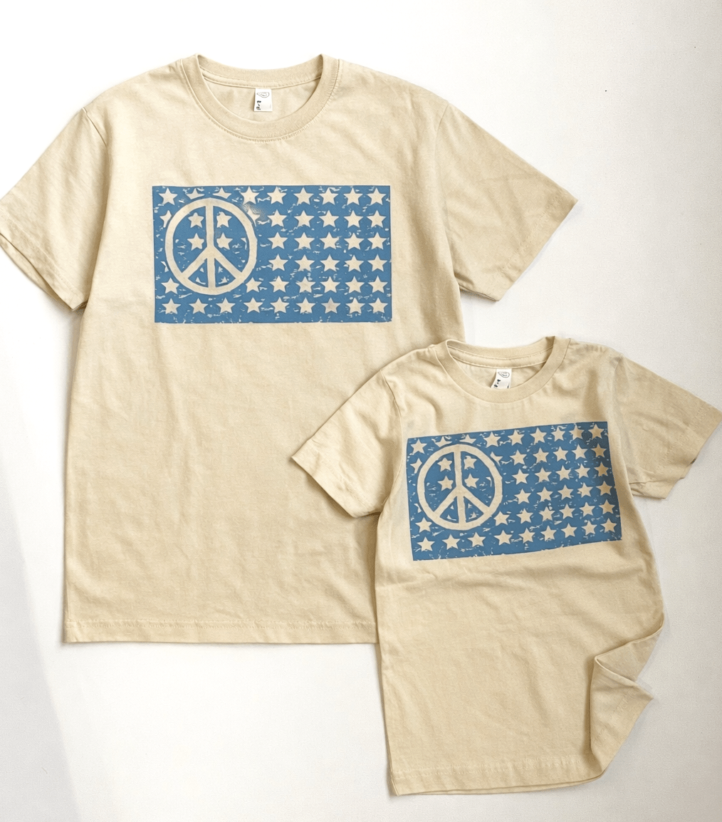 Adult Peace Flag T-Shirt by The Wishing Elephant featuring a colorful peace flag design on a casual tee.