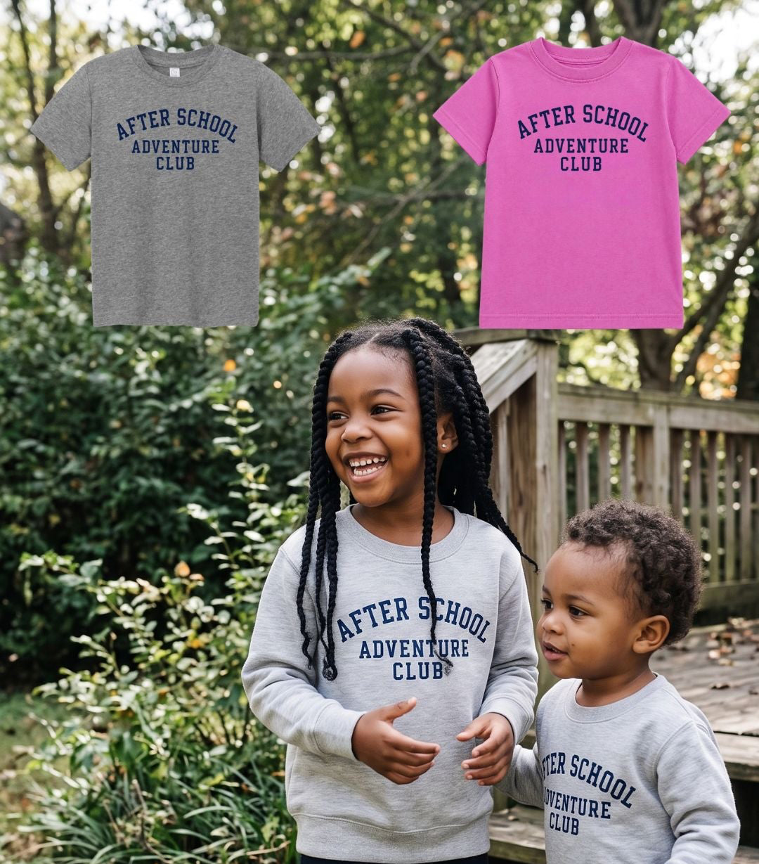 Two children wearing matching gray long-sleeve t-shirts with 'AFTER SCHOOL ADVENTURE CLUB' printed in navy blue, standing outdoors on a wooden deck. Two additional color options (gray and pink) are shown in a floating graphic at the top left.