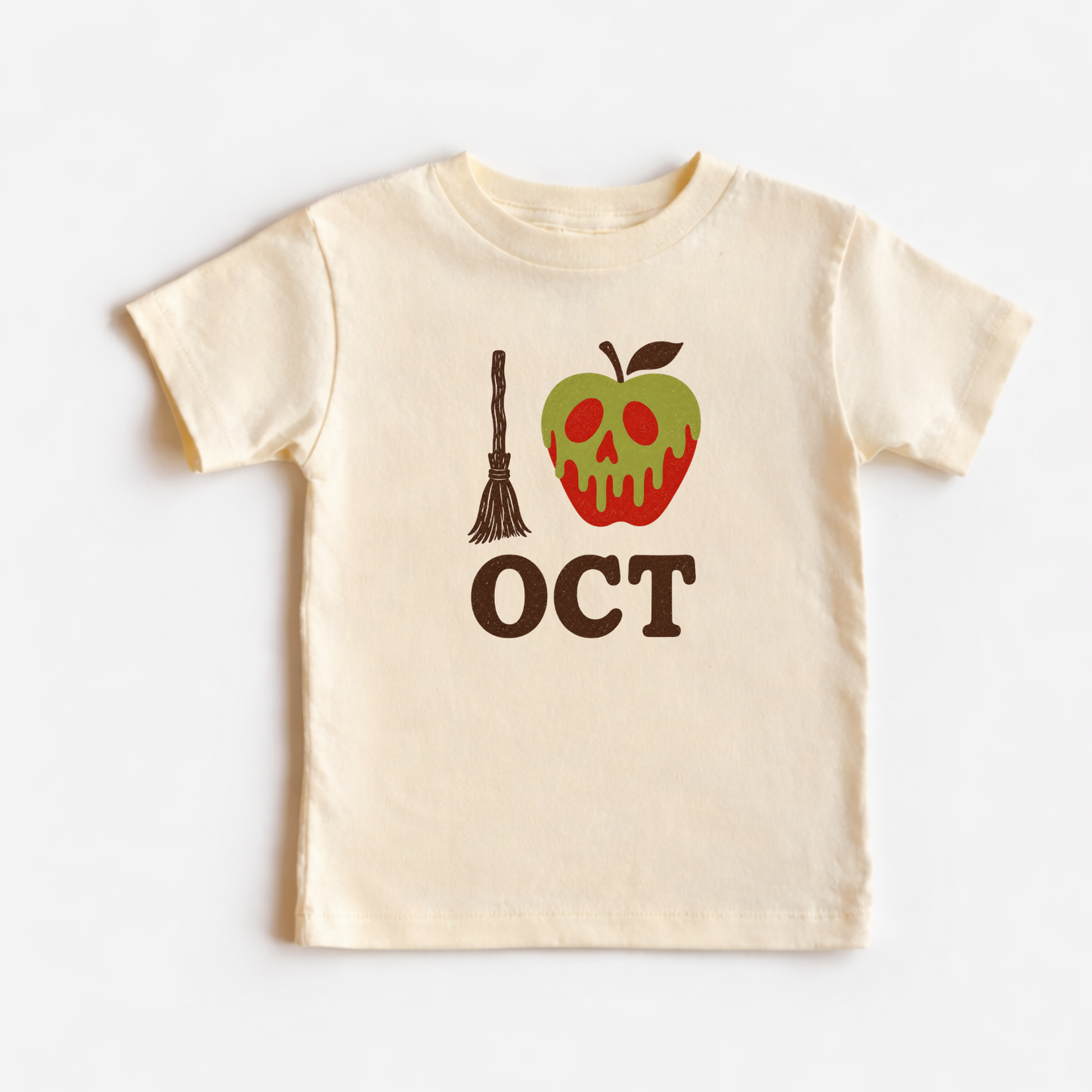 A cream-colored short-sleeve baby t-shirt with a Halloween graphic on the front. The graphic features a broomstick, a green apple with a red mouth and eye sockets, and the word 'OCT' in brown.