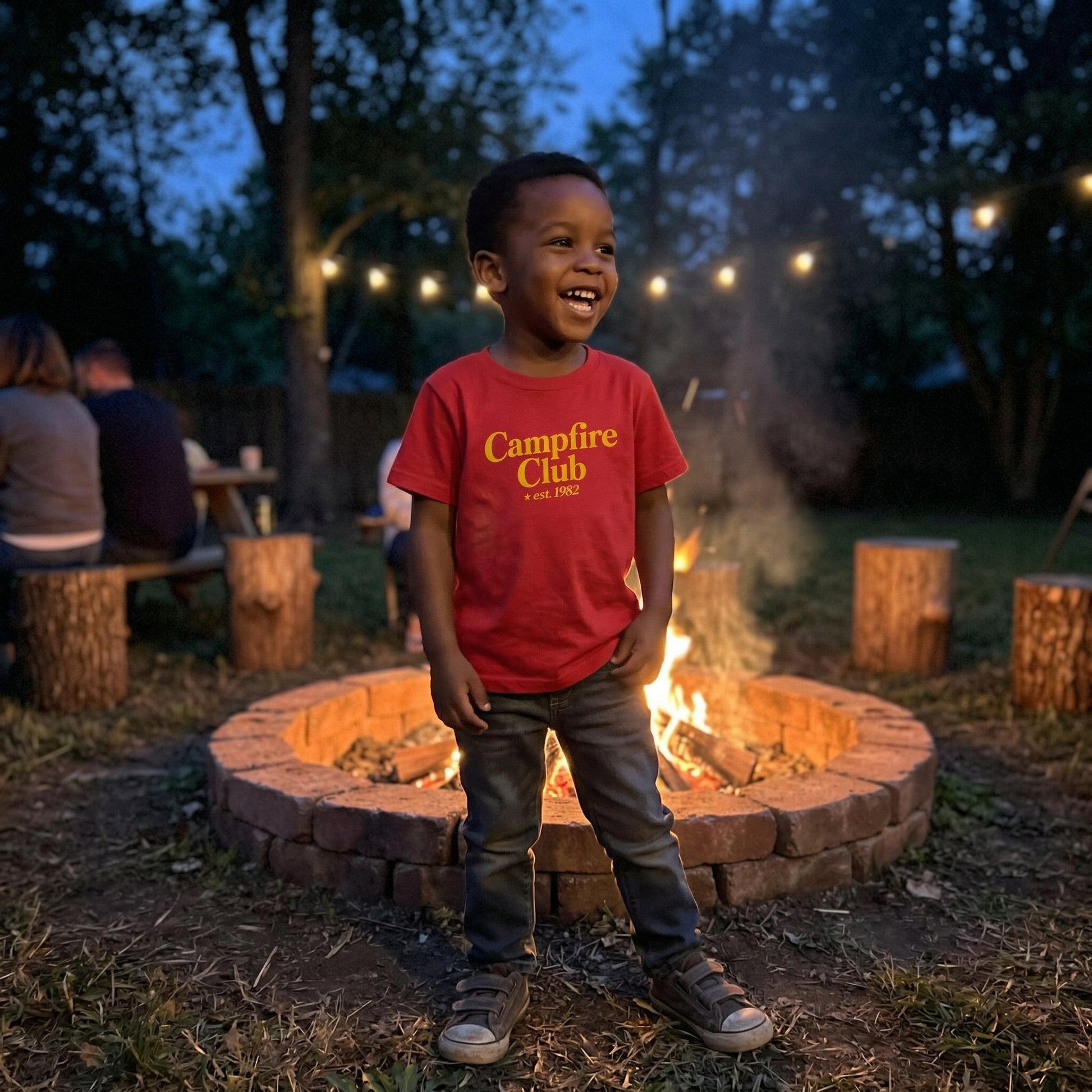 Red kids' graphic tee from The Wishing Elephant featuring a fun campfire design, perfect for summer wear.