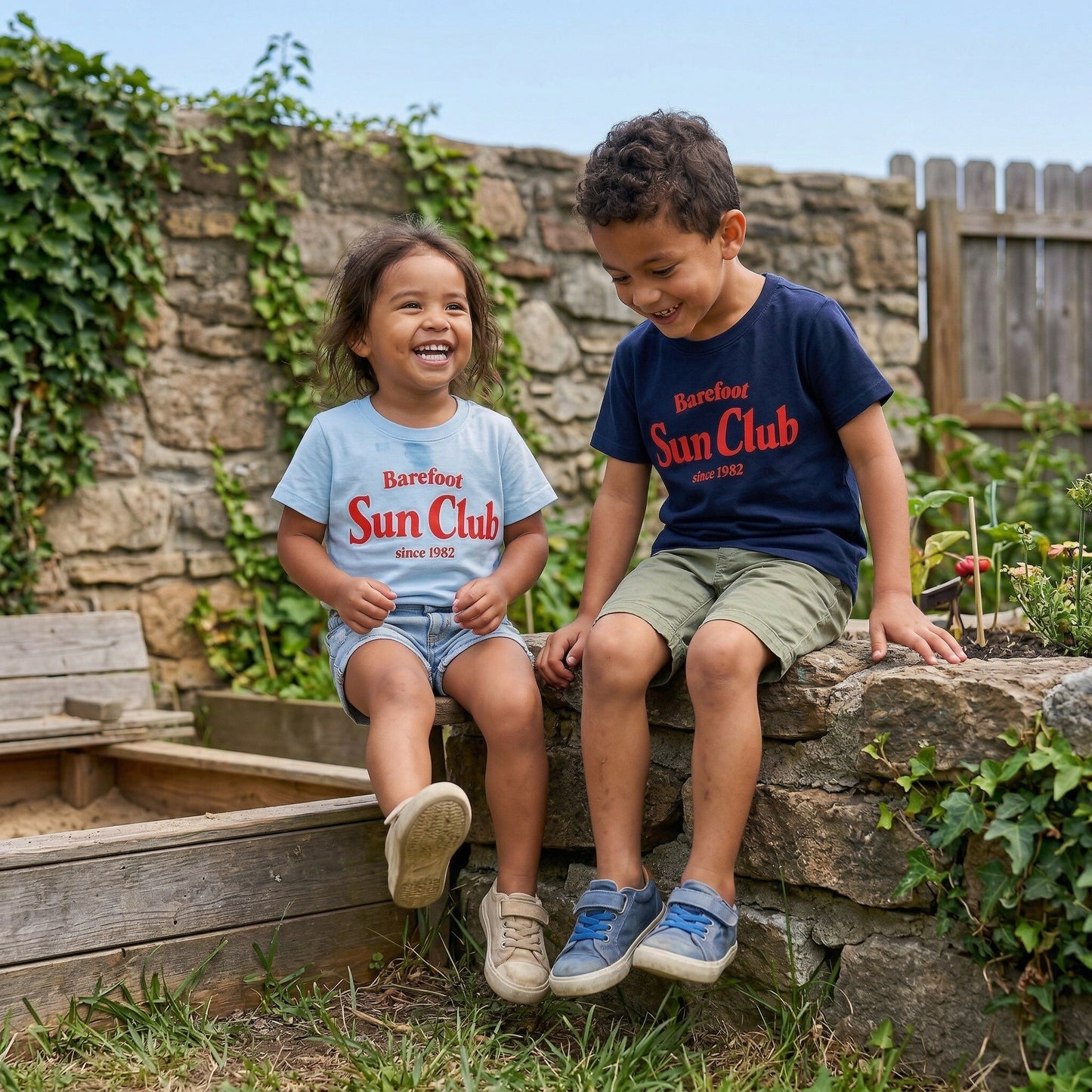 Kids graphic T-shirt by The Wishing Elephant with a colorful summer sun design, perfect for kids' casual wear.