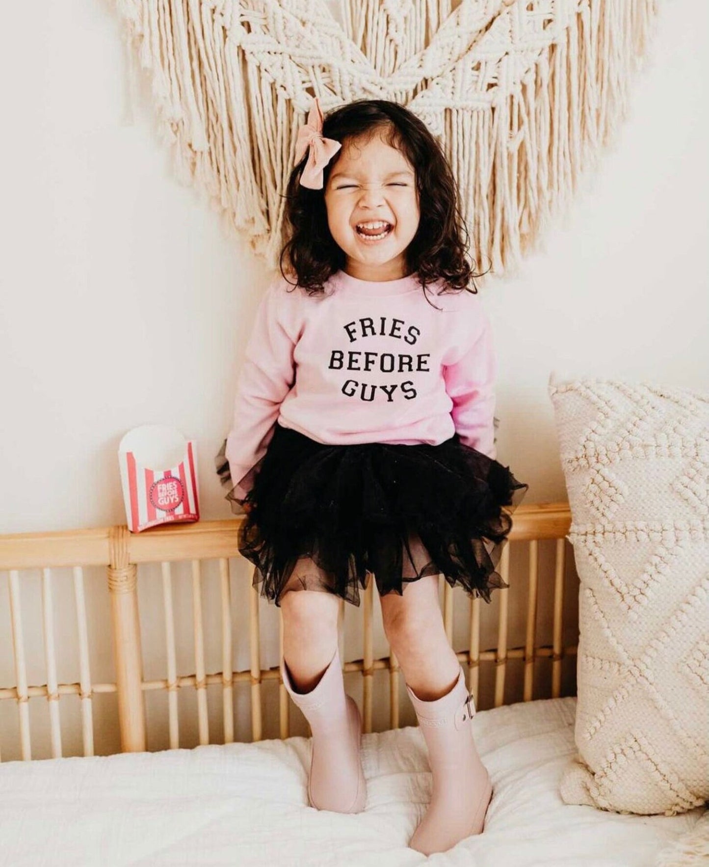 girl smiling in tutu and fries before guys pink sweatshirt