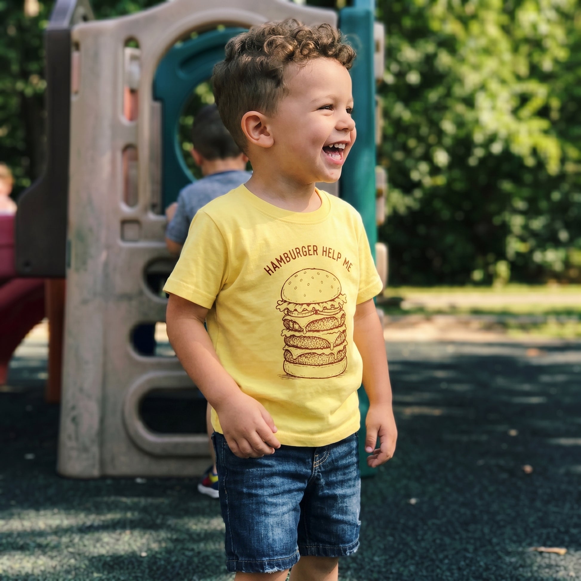 Toddler's funny hamburger help me graphic T-shirt by The Wishing Elephant, featuring a playful burger design for kids.