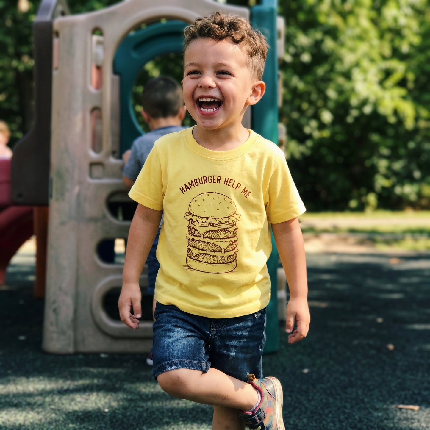 Toddler's funny Hamburger Help Me T-shirt by The Wishing Elephant featuring a playful burger graphic for kids.