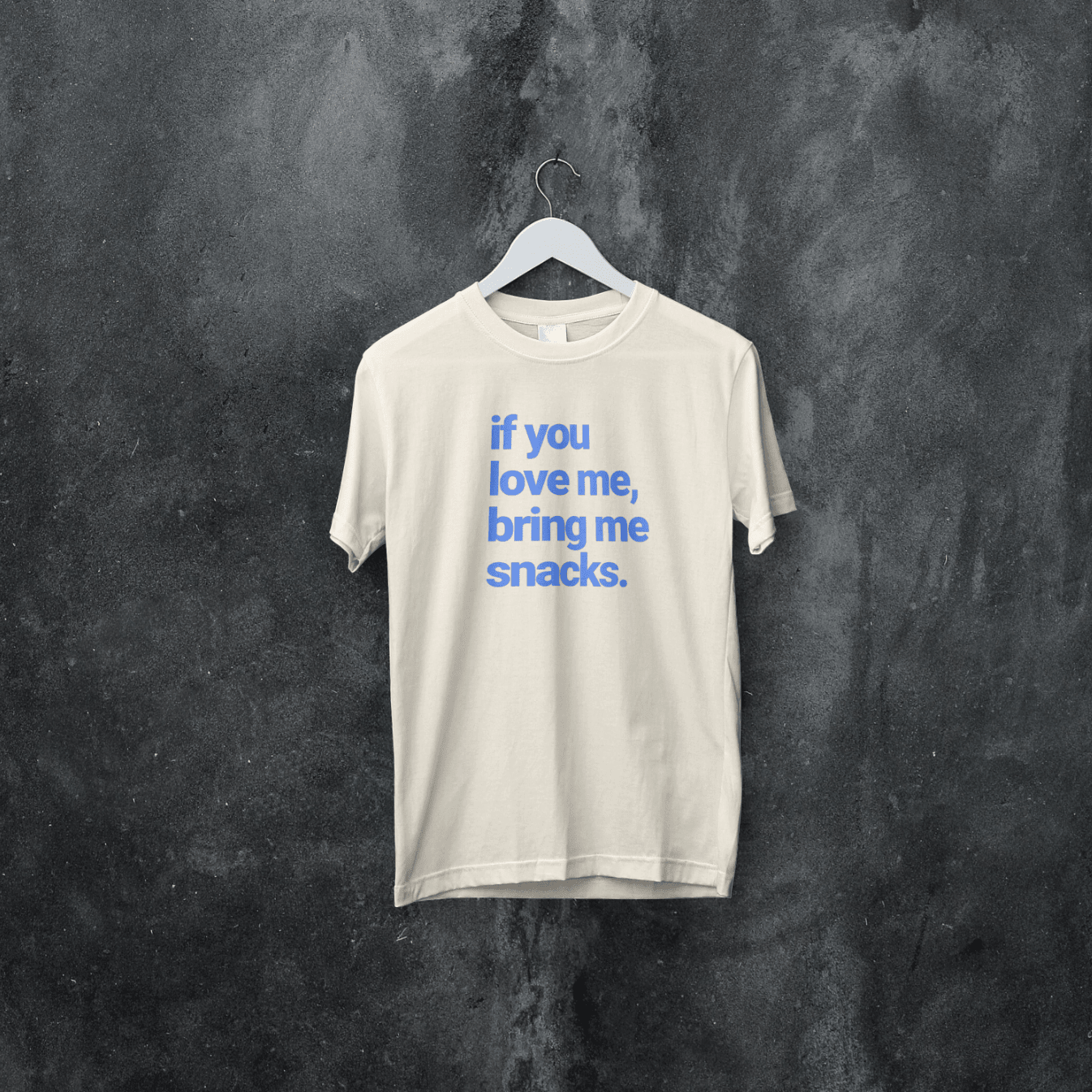 Kids and adults' graphic T-shirt by The Wishing Elephant with "If You Love Me, Bring Me Snacks" text and playful design.