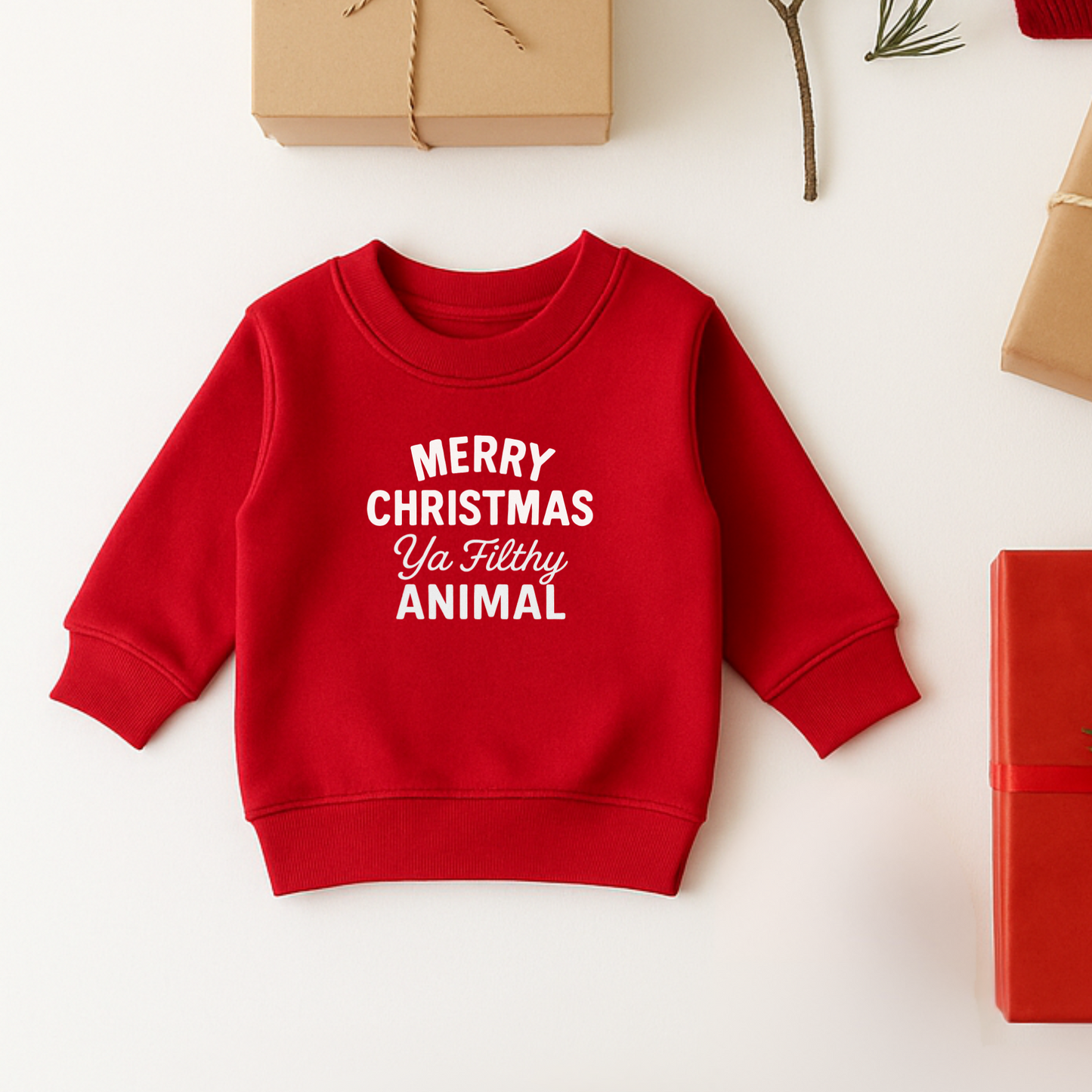 Red children's sweatshirt with 'Merry Christmas Ya Filthy Animal' text on a white background with Christmas decorations. home alone sweatshirt for kids
