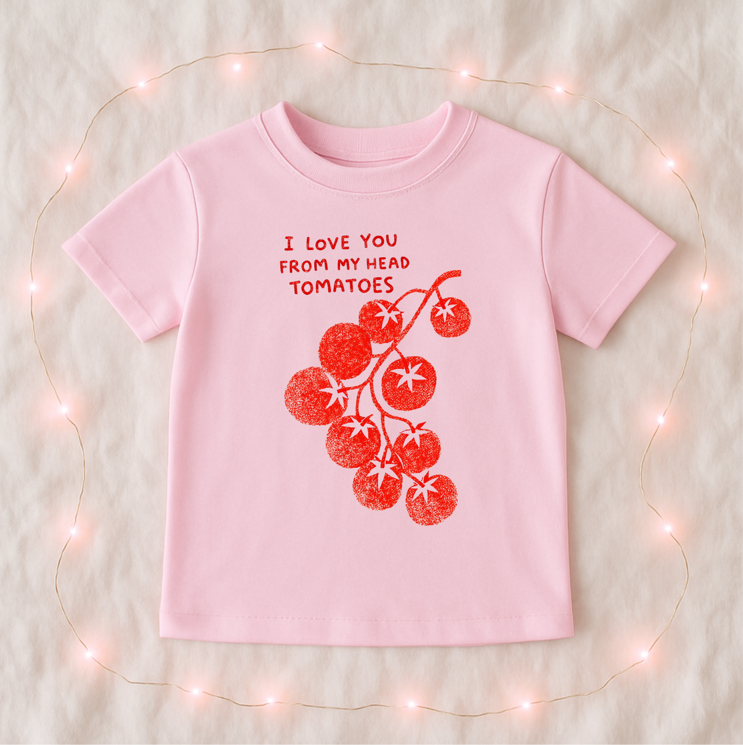Pink "Love You from My Head Tomatoes" T-shirt by The Wishing Elephant featuring playful tomato-themed design.