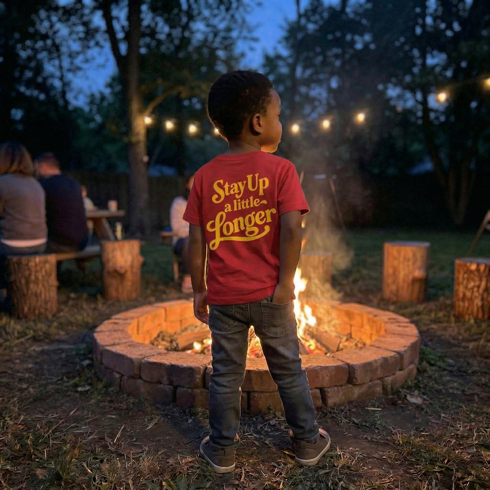Back view of The Wishing Elephant Campfire Club Kids graphic T-shirt in red, featuring a fun campfire design for summer wear.