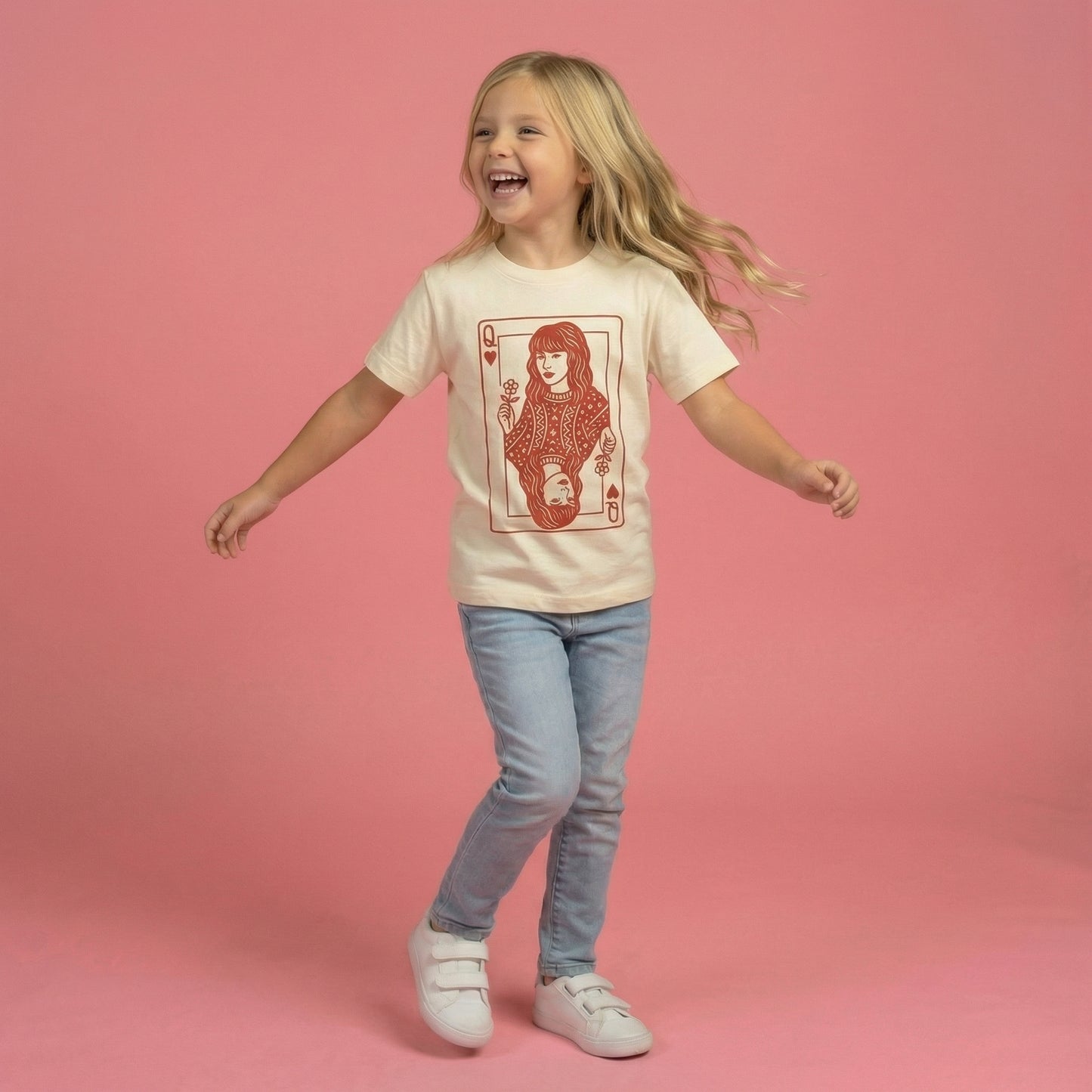Child wearing a t-shirt with a graphic design on a pink background Taylor queen of hearts valentine shirt