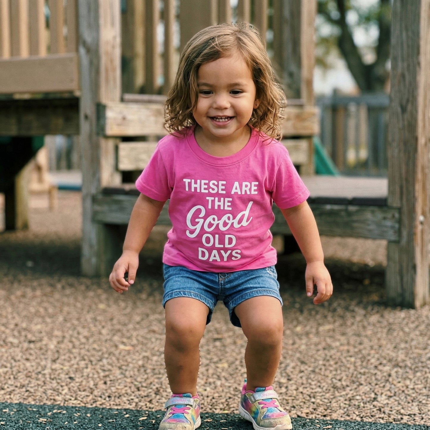Pink kids graphic tee for girls with "These Are The Good Old Days" print by The Wishing Elephant, featuring fun, colorful design.