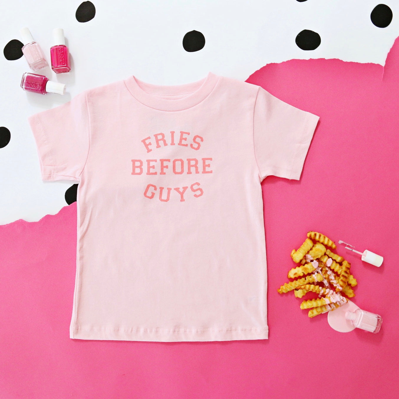 Fries Before Guys shirt flat lay with pink background

Funny retro t-shirt for toddlers – fries before guys design

Girl wearing Fries Before Guys tee in backyard

Sassy pink kids’ shirt with retro camp vibes